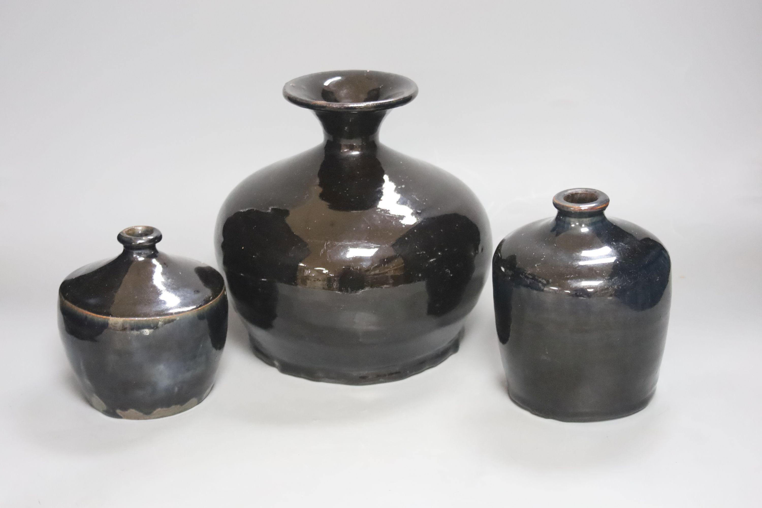 Three Chinese Shanxi black glazed jars, Qing dynasty, height 12 - 20cm